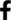 A black cross with green squares on it.